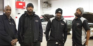 four mechanics auto technicians